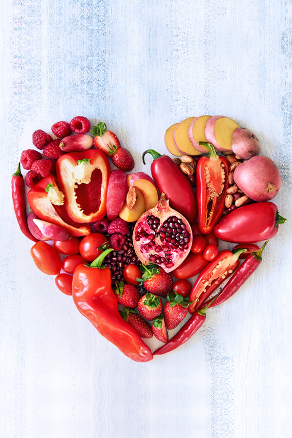 Red veggies and fruit in a heart